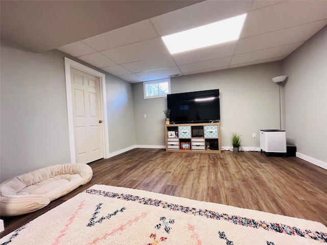 502 Illinois Ave, Valier, MT 59486 - living area featuring wood finished floors, baseboards, and a drop ceiling