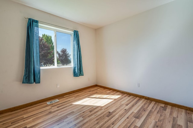 144 Beargrass Ln, Kalispell, MT 59901 - unfurnished room with wood finished floors and baseboards