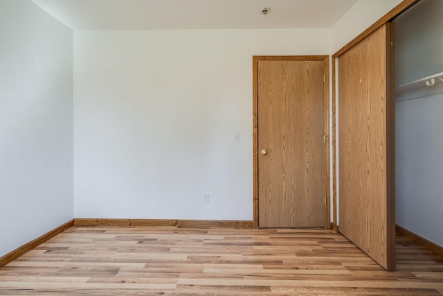 144 Beargrass Ln, Kalispell, MT 59901 - unfurnished bedroom featuring a closet and light wood-type flooring
