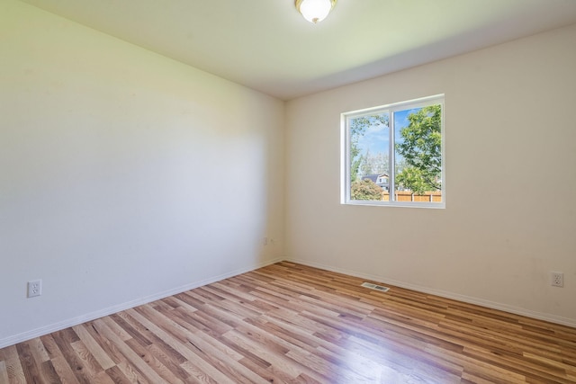 144 Beargrass Ln, Kalispell, MT 59901 - empty room with light wood-style flooring and baseboards