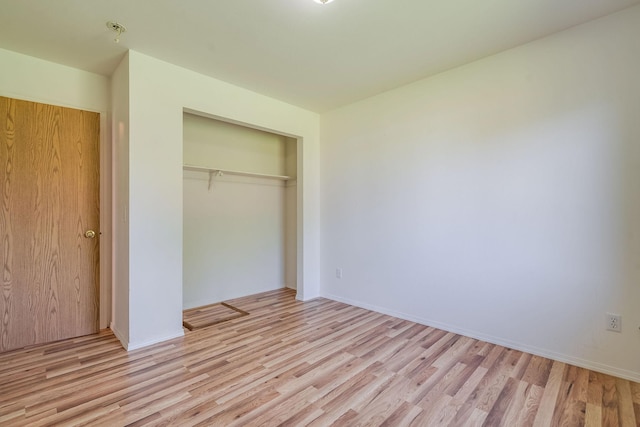 144 Beargrass Ln, Kalispell, MT 59901 - unfurnished bedroom with light wood-style flooring and a closet