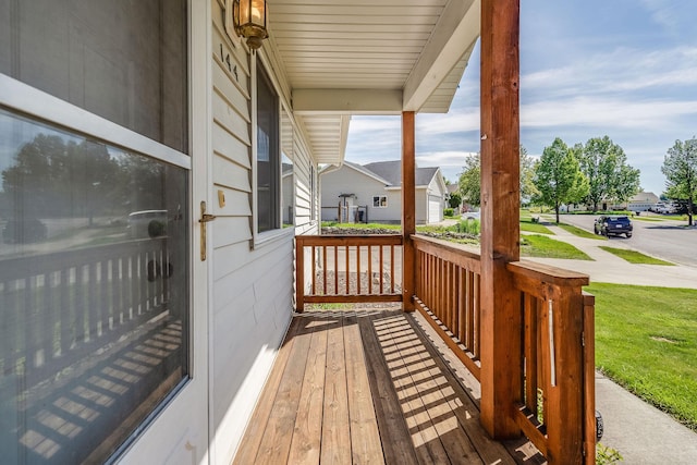 144 Beargrass Ln, Kalispell, MT 59901 - wooden porch with a residential view