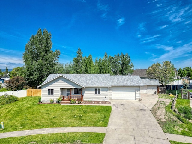 144 Beargrass Ln, Kalispell, MT 59901 - single story home with a porch, a garage, concrete driveway, and a shingled roof