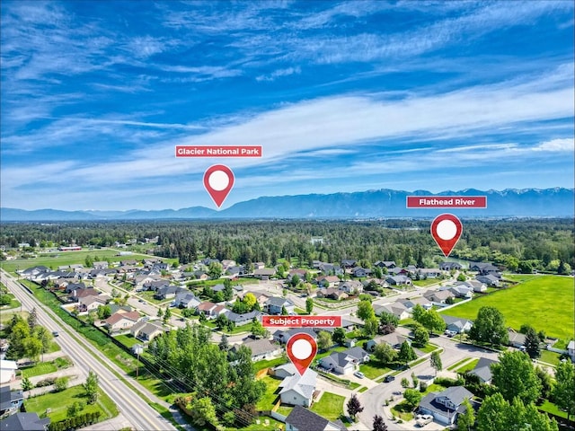 144 Beargrass Ln, Kalispell, MT 59901 - aerial perspective of suburban area with a mountain backdrop