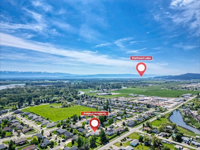 144 Beargrass Ln, Kalispell, MT 59901 - aerial view of property and surrounding area with a water and mountain view