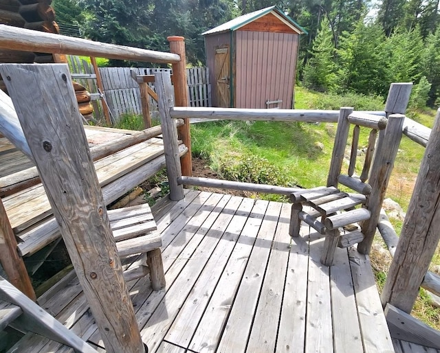 438 Little Mill Creek Rd, Saint Regis, MT 59866 - wooden deck featuring a wooded view
