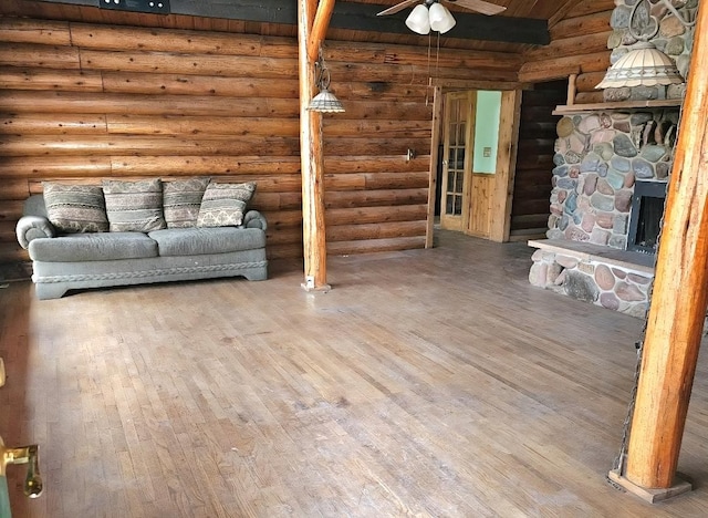 438 Little Mill Creek Rd, Saint Regis, MT 59866 - living room with hardwood / wood-style floors, log walls, a ceiling fan, wood ceiling, and vaulted ceiling