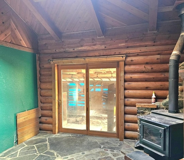 438 Little Mill Creek Rd, Saint Regis, MT 59866 - entryway featuring a wood stove, rustic walls, and wooden ceiling with exposed beams