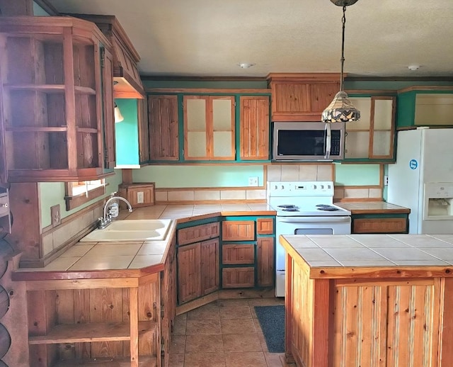 438 Little Mill Creek Rd, Saint Regis, MT 59866 - kitchen with white appliances, tile countertops, a sink, and open shelves