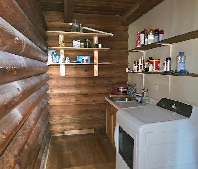 438 Little Mill Creek Rd, Saint Regis, MT 59866 - washroom with washer / dryer, log walls, wood finished floors, wood ceiling, and cabinet space