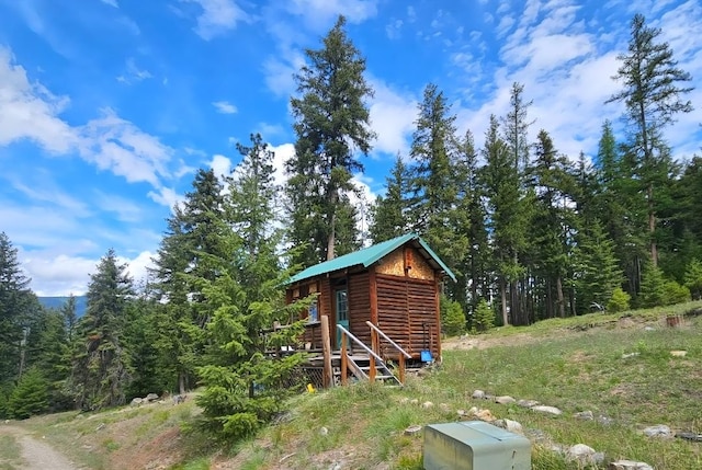 438 Little Mill Creek Rd, Saint Regis, MT 59866 - view of outdoor structure featuring a view of trees
