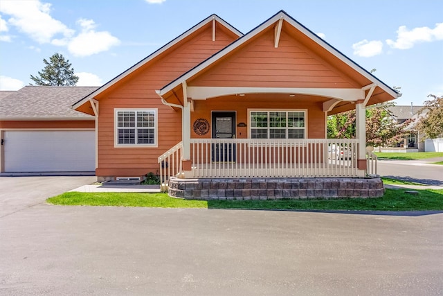 1337A Lily Ct, Missoula, MT 59802 - view of front of house with covered porch, driveway, and an attached garage
