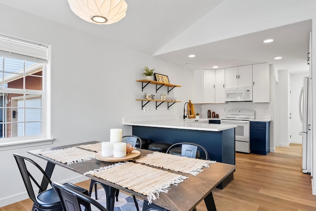 1337A Lily Ct, Missoula, MT 59802 - dining area featuring light wood-style floors, lofted ceiling, baseboards, and recessed lighting