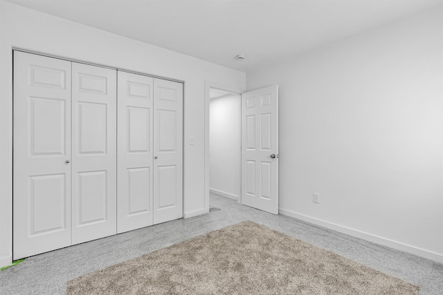 1337A Lily Ct, Missoula, MT 59802 - unfurnished bedroom featuring carpet, a closet, and baseboards