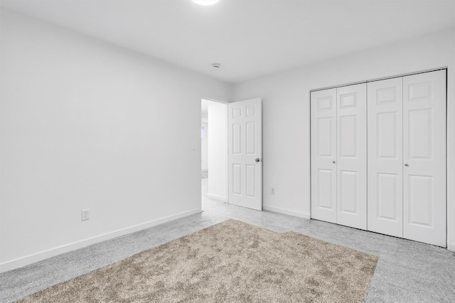 1337A Lily Ct, Missoula, MT 59802 - unfurnished bedroom with carpet flooring, baseboards, and a closet