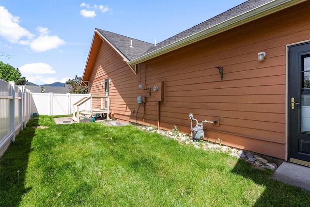 1337A Lily Ct, Missoula, MT 59802 - view of side of property with a gate and a shingled roof