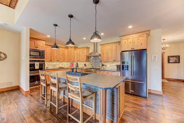 20 Penny Ln, Clancy, MT 59634 - kitchen with stainless steel appliances, wall chimney range hood, light brown cabinetry, dark wood-type flooring, and recessed lighting
