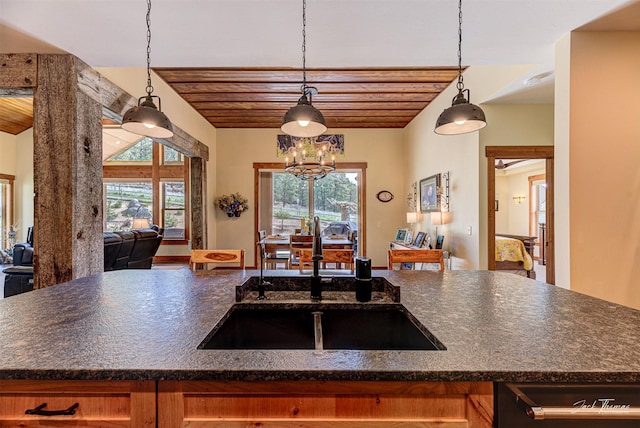 20 Penny Ln, Clancy, MT 59634 - kitchen with dark countertops, open floor plan, wood ceiling, a chandelier, and pendant lighting
