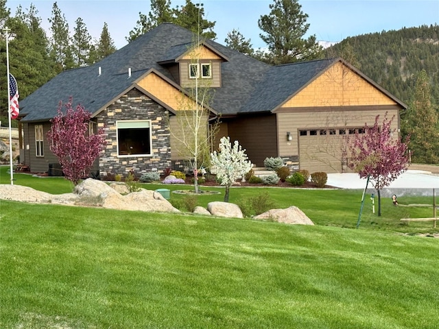 20 Penny Ln, Clancy, MT 59634 - craftsman house featuring a garage, a front yard, roof with shingles, stone siding, and driveway