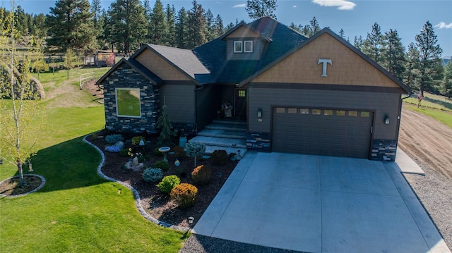 20 Penny Ln, Clancy, MT 59634 - craftsman-style home featuring an attached garage, driveway, a front lawn, and stone siding