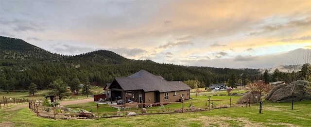 20 Penny Ln, Clancy, MT 59634 - back of house at dusk with a view of trees and a mountain view
