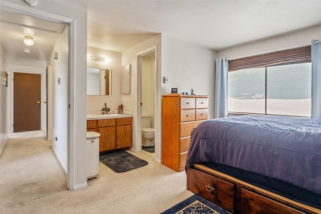 2404 56th St, Missoula, MT 59803 - bedroom with light carpet and ensuite bathroom