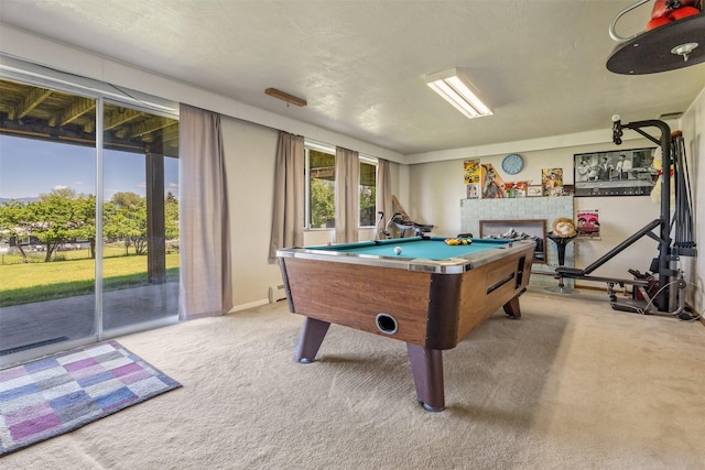 2404 56th St, Missoula, MT 59803 - game room with pool table, light colored carpet, a fireplace, a baseboard radiator, and baseboards