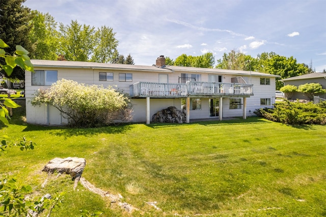 2404 56th St, Missoula, MT 59803 - back of house featuring a chimney, a lawn, and a wooden deck