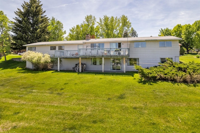 2404 56th St, Missoula, MT 59803 - rear view of property featuring a deck, a yard, and a chimney
