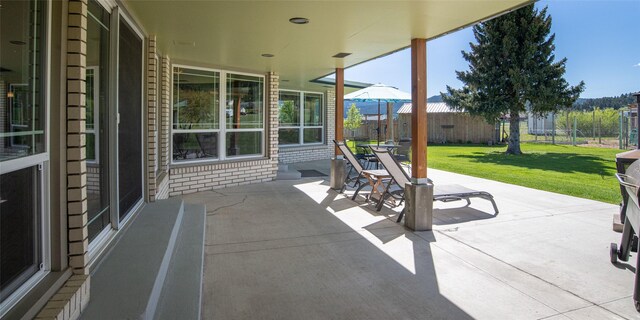 345 Ash Dr, Butte, MT 59701 - view of patio with entry steps, a mountain view, and outdoor dining space