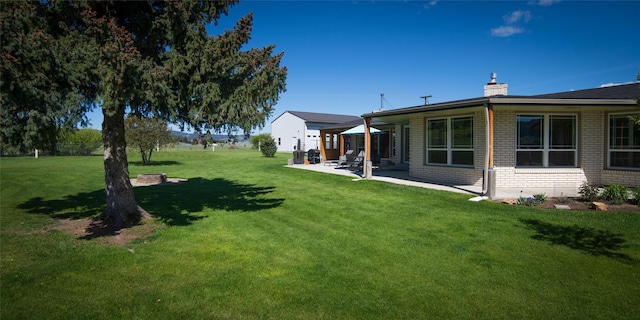 345 Ash Dr, Butte, MT 59701 - view of grassy yard with a patio area