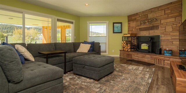 345 Ash Dr, Butte, MT 59701 - dining space featuring dark wood-style flooring, baseboards, and a stone fireplace