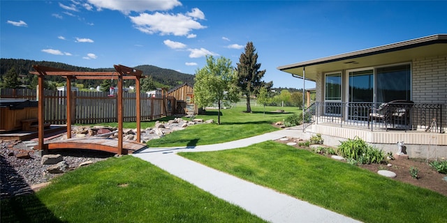 345 Ash Dr, Butte, MT 59701 - view of yard featuring a pergola, a mountain view, and a hot tub