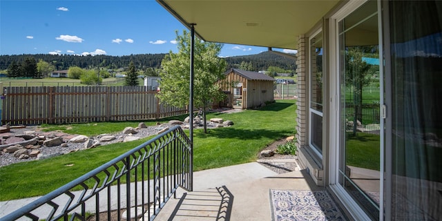 345 Ash Dr, Butte, MT 59701 - view of patio with a forest view