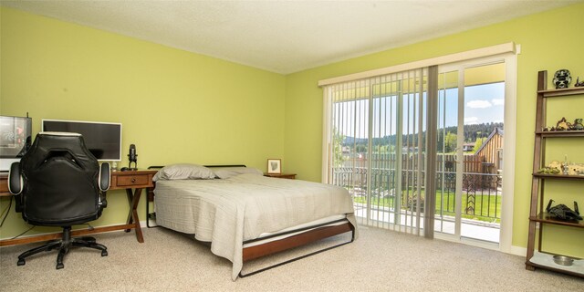 345 Ash Dr, Butte, MT 59701 - view of patio with a forest view