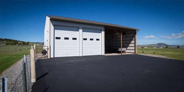345 Ash Dr, Butte, MT 59701 - garage featuring a garage and a mountain view