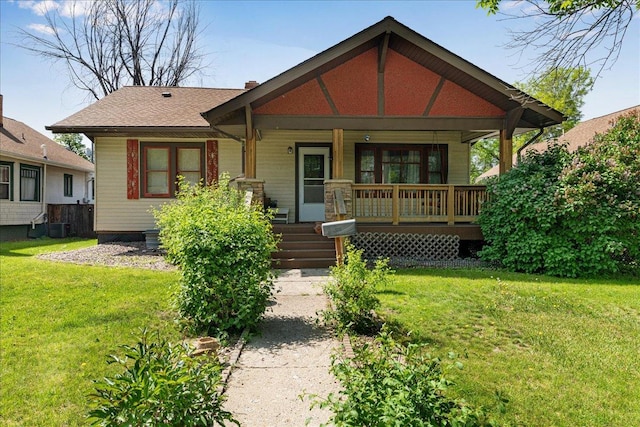1712 1st Ave N, Great Falls, MT 59401 - view of front of home featuring a porch, a front lawn, and central AC unit