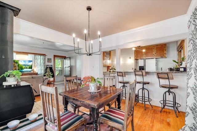 1712 1st Ave N, Great Falls, MT 59401 - dining area featuring a chandelier, light wood-style floors, and ornamental molding