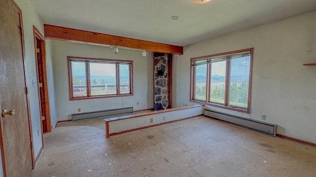 6180 Elkhorn Rd, Helena, MT 59602 - spare room featuring a baseboard heating unit, baseboards, and beamed ceiling