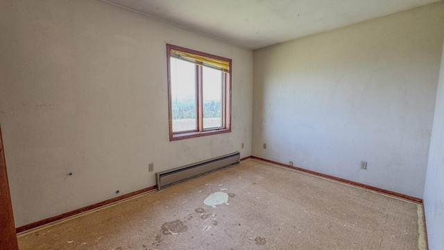 6180 Elkhorn Rd, Helena, MT 59602 - unfurnished room with a baseboard heating unit and baseboards