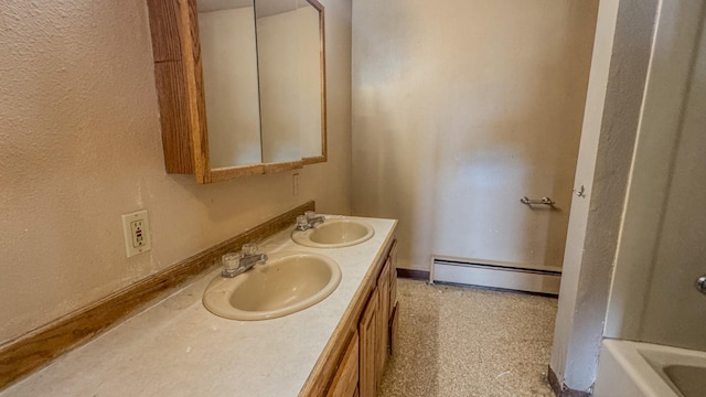 6180 Elkhorn Rd, Helena, MT 59602 - bathroom featuring baseboard heating, double vanity, and a textured wall