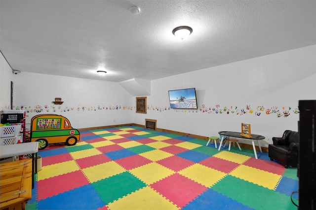 300 Morning View Dr, Kalispell, MT 59901 - rec room featuring tile patterned floors, a textured ceiling, and baseboards
