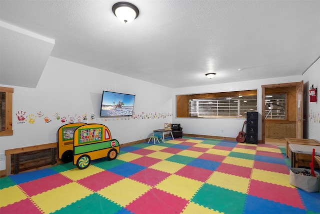 300 Morning View Dr, Kalispell, MT 59901 - playroom with tile patterned floors and a textured ceiling