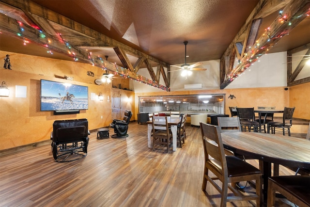 300 Morning View Dr, Kalispell, MT 59901 - dining area with wood finished floors, a ceiling fan, a textured wall, and baseboards