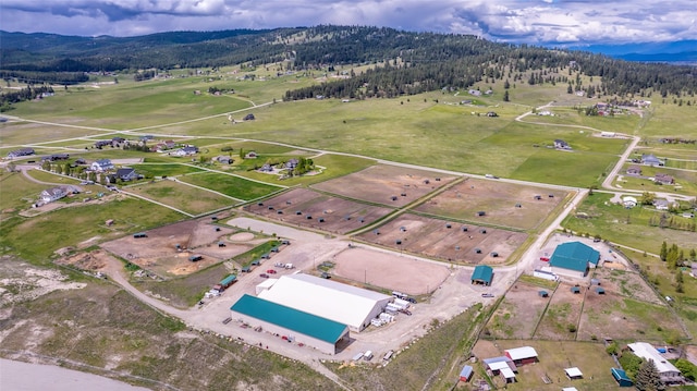 300 Morning View Dr, Kalispell, MT 59901 - view of property location featuring a mountainous background and a forest