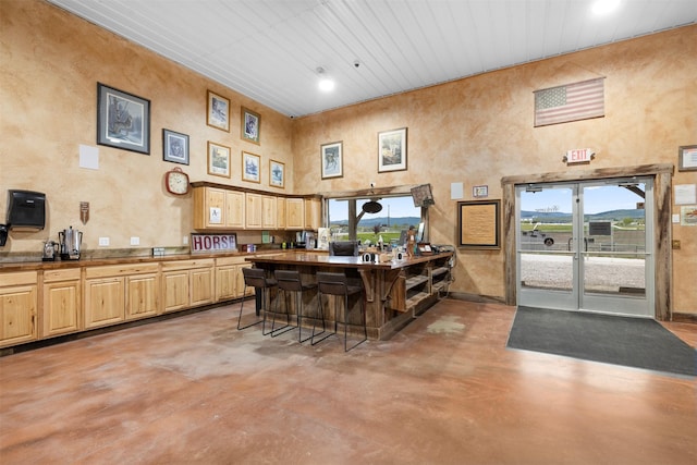 300 Morning View Dr, Kalispell, MT 59901 - bar with finished concrete floors, plenty of natural light, and a towering ceiling