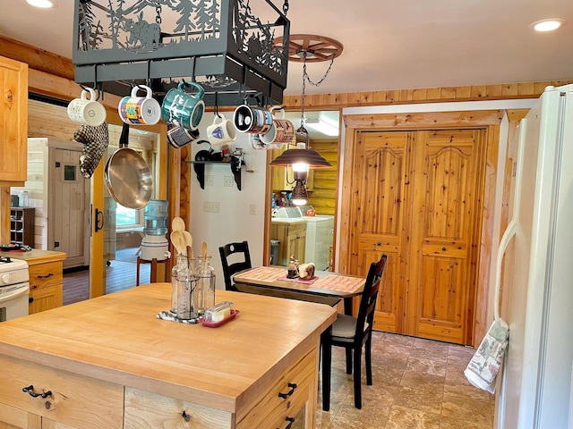 30 Williams Gulch Loop, Philipsburg, MT 59858 - dining area featuring washing machine and clothes dryer, recessed lighting, and light stone finish floors