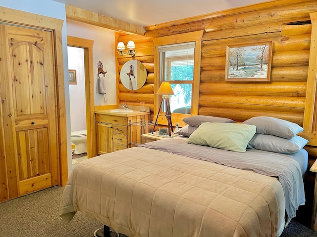 30 Williams Gulch Loop, Philipsburg, MT 59858 - carpeted bedroom featuring rustic walls and ensuite bathroom