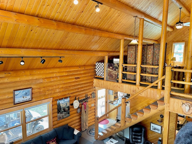30 Williams Gulch Loop, Philipsburg, MT 59858 - living area featuring rail lighting, a wood ceiling with exposed beams, log walls, and ceiling fan