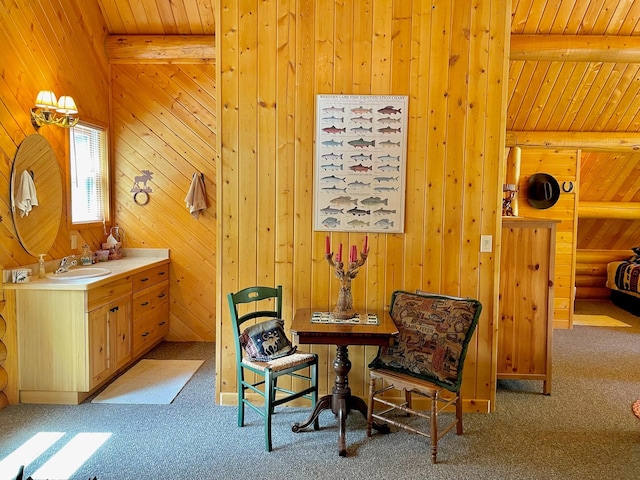 30 Williams Gulch Loop, Philipsburg, MT 59858 - living area with carpet flooring, a wood ceiling with exposed beams, and wood walls